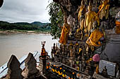 Luang Prabang, Laos - The Pak Ou Caves, the lower cave called Tham Ting. The caves, a Buddhist pilgrimage site, are a repository of old Buddha statues.